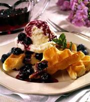 Dessert Waffles With Spiced Blueberry Sauce combine crisp and
creamy textures to create a sweet summer treat.