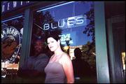 Carlisha Bell, 24, a Kansas University student from Wichita,
photographed a couple in front of Brown Bear Brewing Co., 729 Mass.