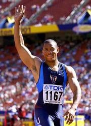 Maurice Greene waves to the crowd after finishing a first-round
heat in the 100 meters in the World Track and Field Championships
on Saturday in Edmonton, Alberta.