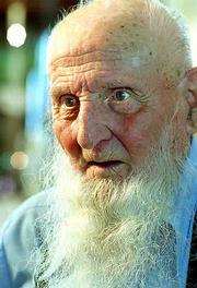 92-year-old Henry Flory recalls his grandmother Suzanah Flory
telling stories about the time Quantrill's men burned her father's
home in Douglas County. Flory, a retired farmer, is a lifetime
Douglas County resident and a member of the Old German Baptist
Brethren Church.