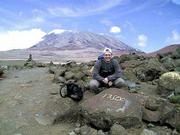 On his quest to climb Mount Kilimanjaro, Bryan Haack rests briefly
at the 13,500-foot milestone. It took Haack, a Lawrence native and
digital hardware engineer with Motorola, six hours to climb the
final 690 feet to the summit, but only 30 minutes to climb down
that same distance.