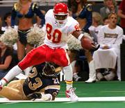 Kansas City's Larry Parker stretches for the end zone as he is
dragged out of bounds by St. Louis' Devin Bush. The Rams edged the
Chiefs, 21-17, on Friday in St. Louis.
