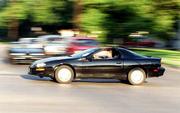 Columnist Seth Jones speeds through a Lawrence intersection in his
1999 Chevrolet Camaro in search of racing opponents.