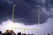 Lightning strikes beyond the scoreboard at Shawnee Heights'
football field in Tecumseh. The Firebirds were leading, 14-6, in
the second quarter when the game was interrupted by lightning. The
contest will resume at noon today in Tecumseh.