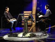 Contestant Paul Yip, left, sits across from host Ken Chan during a
filming of ATV&squot;s Chinese-language version of the television
phenomenon "Who Wants to Be a Millionaire" in Hong Kong. The new
show has gained an enormous following with Hong Kong audiences.