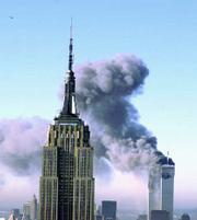 Plumes of smoke pour from the World Trade Center buildings in New
York Tuesday, Sept. 11, 2001. Planes crashed into the upper floors
of both World Trade Center towers minutes apart Tuesday in a
horrific scene of explosions and fires that left gaping holes in
the 110-story buildings. The Empire State building is seen in the
foreground.