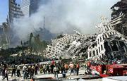 Hundreds of rescue workers continue their search as smoke rises
from the rubble of the World Trade Center. No survivors from
Tuesday's attack were found in Thursday's search.