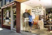 A sign in Angela Conrad&squot;s store, "My Father&squot;s Daughter," 844 Mass.,
was inspired by her father, a 25-year Army veteran and by Conrad&squot;s
desire to help in any way possible after Tuesday&squot;s terrorist
attacks on New York and Washington, D.C. Conrad, with her father,
Matt Massoth, Leavenworth, at the store Thursday, said that on the
day she put the sign up a woman from New York came in to hug her
and tell her how much it meant.