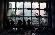 Resting inside the ruins of 2 World Financial Center, firefighters
look into the World Trade Center rubble while taking a break from
rescue efforts. Thursday, no survivors from Tuesday's fatal attack
were rescued.