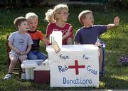 These children are doing their part to help victims of Tueday's
terrorist attacks by trading lemonade for donations along Kasold
Drive. From left are Jacob Russell, 3; Cole Wolff, 3; Kajsa
Mullenix, 9; and Kjell Mullenix, 6. Kajsa said she planned to have
the stand open this afternoon, offering hot cocoa and coffee.