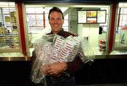 Lawrence businessman Steve Vormehr, owner of Mid-America
Concessions Inc., has his hands full of cups as he finishes
stocking concessions stands for a 1999 KU-Pepperdine football game
in this file photo. Vormehr died of a sudden illness Thursday.