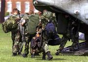 Marines board a CH-46 Sea Knight helicopter at Camp Lejeune, N.C.,
before being flown to the USS Bataan to begin a six-month
deployment to the Mediterranean with the 26th Marine Expeditionary
Unit. The U.S. military is organizing for Operation Infinite
Justice to avenge the attacks on America.