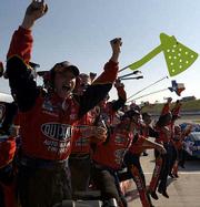 Jeff Gordon's pit crew celebrates after Gordon won the Protection
One 400. The series points leaders won the first Winston Cup race
at Kansas Speedway on Sunday at Kansas City, Kan.