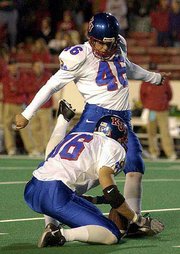 Kansas KICKER Johnny Beck drills a second-half field goal. His
field goal in the second overtime lifted KU to a 34-31 double
overtime victory over Texas Tech on Saturday in Lubbock, Texas.