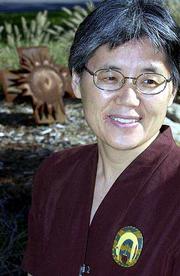 Hwi-Ja Canda, a social worker at Lawrence Memorial Hospital, is
helping patients fill out living wills to determine exactly what
measures will be allowed at the end of their lives.