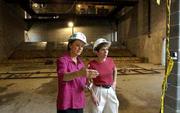 Ann Evans, left, executive director of the Lawrence Arts Center,
and Marilyn Dobski, president of the center's board of directors,
tour the new auditorium and backstage facilities at the
construction site of the new arts center in the 900 block of New
Hampshire.