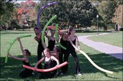 On the final Sunday of the Lawrence "Harvest of Arts" Festival
members of the Lawrence Youth Ballet Ensemble under the direction
of Artistic Director Deborah Bettinger performed in Constant Park.
The event, "Dance on the Sandbar" was relocated to the park due to
high water on the Kansas River.