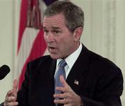 President Bush answers questions from reporters as he holds a news
conference in the East Room of the White House Thursday, Oct. 11,
2001 in Washington.