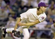 Arizona's Randy johnson delivers a pitch to the St. Louis
Cardinals. Johnson entered the postseason with a career-best 21-6
record in the regular season, but he suffered his seventh straight
playoff loss a major league record in the Diamondbacks' 4-1 loss
Wednesday in Phoenix.