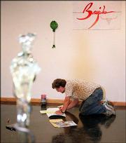 Departing associate professor of art Vernon Brejcha prepares his
for his retrospective show at the Art and Design gallery at the
University of Kansas