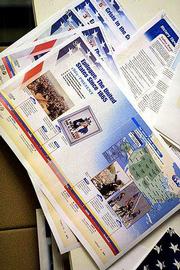 Page proofs of textbook revisions hang on the wall at the Pearson
Education facility in Upper Saddle River, N.J. Textbook publishers
are rushing to revise their books to include references to the
Sept. 11 terrorist attacks.