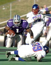 Kansas State's Josh Scobey (1) runs over Kansas' Jake Letourneau.
Scobey finished with 204 yards on 28 carries in the Wildcats' 40-6
victory on Saturday at KSU Stadium.