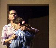 Whitney Armstrong, who plays Mrs. Lenox in "Afternoon of the
Elves," comforts Erin Burns, who is her daughter, Hillary, in the
play. The production will be performed for school children
Monday-Friday and then presented in a public performance Saturday
night at Crafton-Preyer Theatre in Murphy Hall.