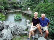 Barbara and J. Kristian Pueschel enjoy one of Suzhou's world-famous
ancient gardens. Well laid out with pavilions, towers, kiosks,
rocks, flowers and trees, they are serene oases combining nature,
architecture and art.