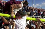 Texas Tech fans storm the field to tear down a goal post. The Red
Raiders stunned No. 24 Texas A&M, 12-0, on Saturday at Lubbock,
Texas.