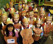 First-graders at Hillcrest School, decked in handmade American
Indian costumes, prepare to march through the school in their
annual Thanksgiving parade. Fresh off of a project in which they
gave their recipes for cooking a Thanksgiving feast, these
students, from Paula Barr's class, joined first-grade classes
taught by Gina Foster and Jan Green for the parade Tuesday.