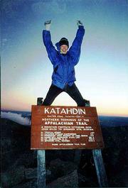 Leslie Scally throws her arms up in excitement at the end of her
six-month trip hiking the entire 2,167-mile Appalachian Trail. The
northern route of the trail ends at Mount Katahdin in Maine's
Baxter State Park. Scally and a group of about 12 hikers started
the final ascent at 2:30 a.m. in order to reach the peak just after
sunrise. The group stayed at the peak for only 1 1/2 hours because
of the 40-degree weather and 30 mph to 40 mph winds.