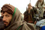 Hamzah, left, a defecting Taliban fighter from Uzbekistan, rides
with other foreign defectors from the frontline toward the
northern-alliance controlled village of Qurbragh, Afghanistan. More
than 200 Taliban fighters defected Sunday on the eastern Kunduz
frontline. U.S. Marines landed early today near the southern city
of Kandahar.