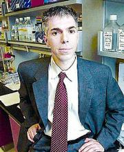 A paper co-authored by Dr. Robert Lanza, seen here in a laboratory
at Advanced Cell Technology in Worcester, Mass., announced Sunday
that ACT had successfully performed somatic cell nuclear transfer
(cloning) to form human preimplantation embryos.