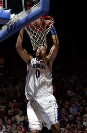 KU's Drew Gooden slams home two of his 26 points. Gooden led the
Jayhawks to a 105-62 rout of Pittsburg State on Wednesday at Allen
Fieldhouse.