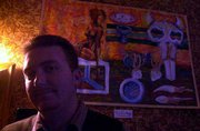 Chris Messer works with acrylics and markers to create "Bits of the
Process," one of his pieces hanging in the back of Henry&squot;s, 11 E.
Eighth St.