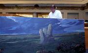 Stan Herd, a local muralist and crop artist, works on a mural in
the new Topeka & Shawnee County Public Library at 1515 W. 10th
St. in Topeka.