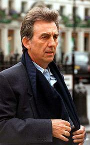 Former Beatle George Harrison, shown in this 1998 file photo, lost
his battle with cancer Thursday in Los Angeles. He was 58.