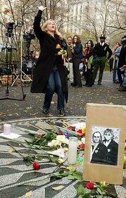 Shelley Joy says a prayer for peace and in memory of former Beatle
George Harrison at Strawberry Fields in New York's Central Park.