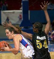 Kansas University's Kristin Geoffroy, left, is pressured by Alabama
State's Tamara Norris. KU won, 62-61, Friday night at Allen
Fieldhouse in the first round of the Jayhawk Classic.