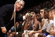 KU coach Roy Williams, left, gives his bench an earful. Williams
was especially miffed KU hit just half of its 40 free-throw
attempts Tuesday at Allen Fieldhouse.