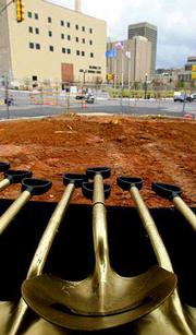 Gold painted shovels wait to be used in the groundbreaking ceremony
for the new federal building in downtown Oklahoma City.