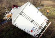 A tractor-trailer is wedged in a creek bed between the West
Lawrence and Lecompton interchanges on the Kansas Turnpike. The
truck crashed about noon Wednesday. The driver was not seriously
injured.