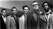 George Clooney, far left, heads a group of criminals (from left,
Brad Pitt, Matt Damon, Elliott Gould and Don Cheadle) who seek to
rob three casinos in "Ocean's Eleven."