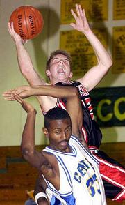 LHS senior D.J. Watkins makes a shot over Center's Odis Smith.
Watkins scored 37 points in the Lions' victory Thursday night at
Stilwell.