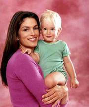 Cindy Crawford and her son Presley have fun trading grins in the
book "About Face." The book encourages communication between adults
and young children by using body language.