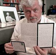 Robert Hirst holds a letter handwritten by author Mark Twain. The
letter, written in the 1890s, is one of eight Twain letters
recently acquired by the University of California in Berkeley.
Hirst heads the school's Mark Twain Project, a growing collection
of home of some 3,000 letters by Twain.