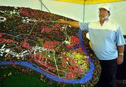 Jim Stevenson shows off a model of Branson he built over the last
two year. Stevenson will take the model and travel throughout the
country to give some exposure to the city.