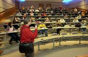 Earle Knowlton, associate professor of special education, talks to
his "Introduction to the Exceptional Child/Adolescent" class in
Joseph R. Pearson Hall at KU. Students will be paying more for
their KU education in the coming years if university administrators
are successful with a planned tuition increase that is under
discussion.