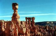 Thor&squot;s Hammer, above left, is perhaps the best example of an odd
rock formation at Bryce Canyon known as "hoodoos." They are formed
when erosion leaves harder stone atop softer stone, which erodes
faster, sometimes leaving a boulder perched atop a tall, narrow
pillar.