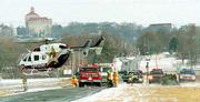 Icy road conditions contributed to an injury accident on East 1400
Road in January 2001. A Lawrence woman was flown from the scene by
LifeStar, and her two children were injured in the one-vehicle
accident. Some worry that the emergency helicopter flights, which
cost about $6,000, are used too often.